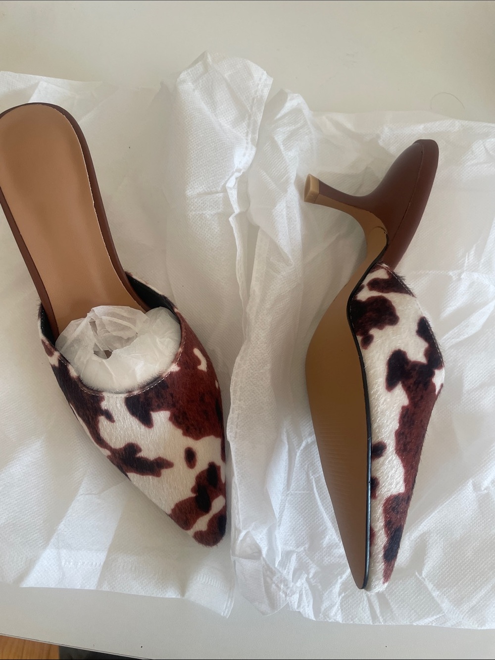 Gorgeous unique cow hide print closed toe kitten heels